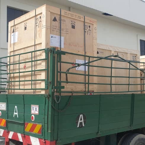 Sturdy wooden export crates loaded on an M&C lorry ready for relocation